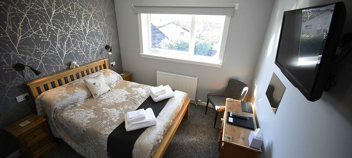 Our self catering apartment suite accommodation has a double bed with smart tv and WIFI internet