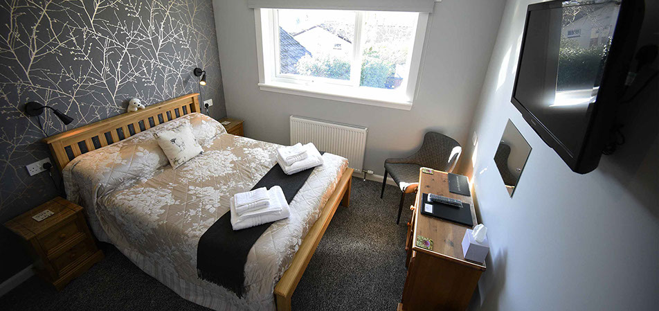 Our self catering apartment suite accommodation has a double bed with smart tv and WIFI internet